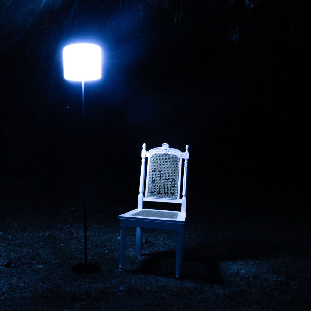 White-chair-dark-outside-blue-light