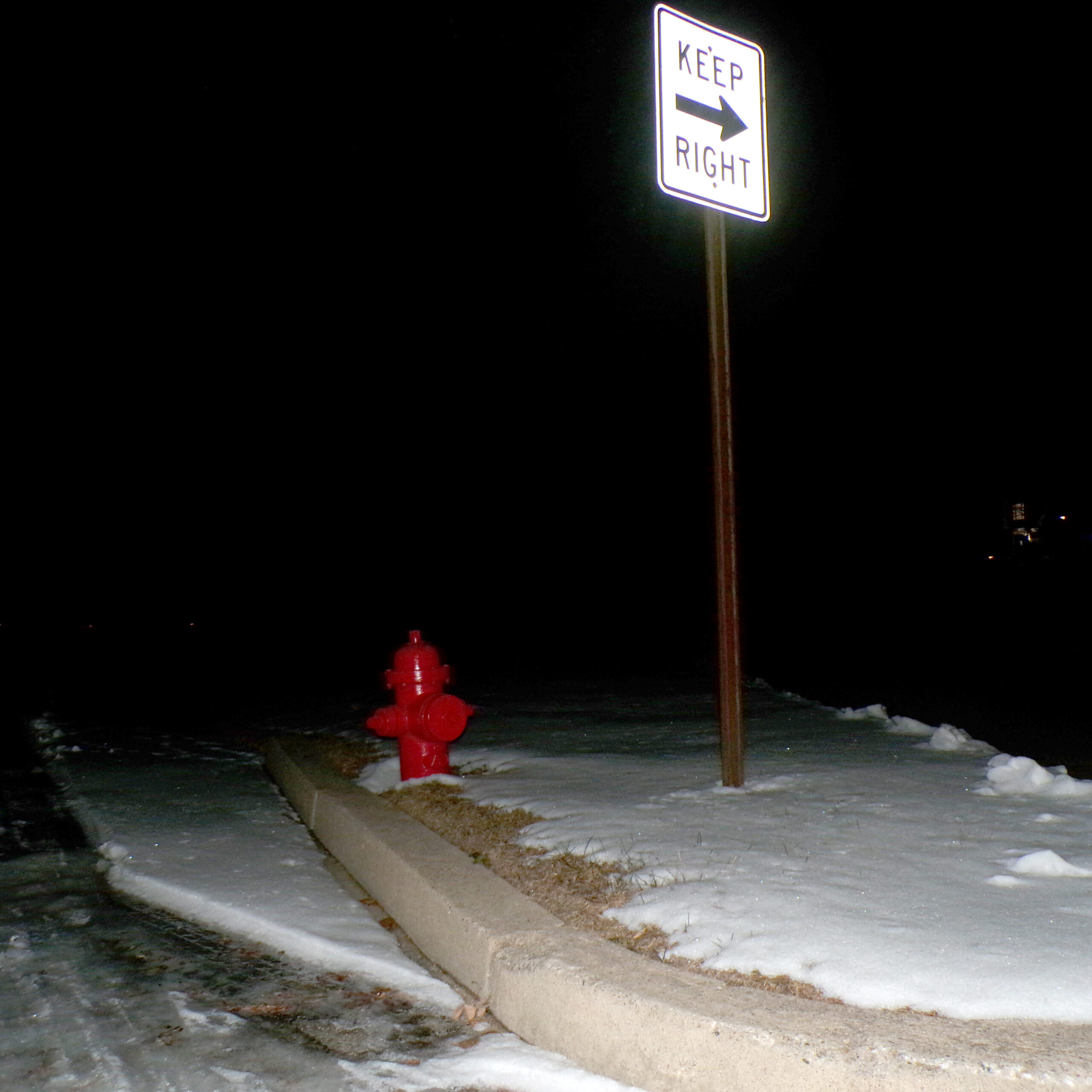 winter-night-fire-hydrant-keep-right-sign
